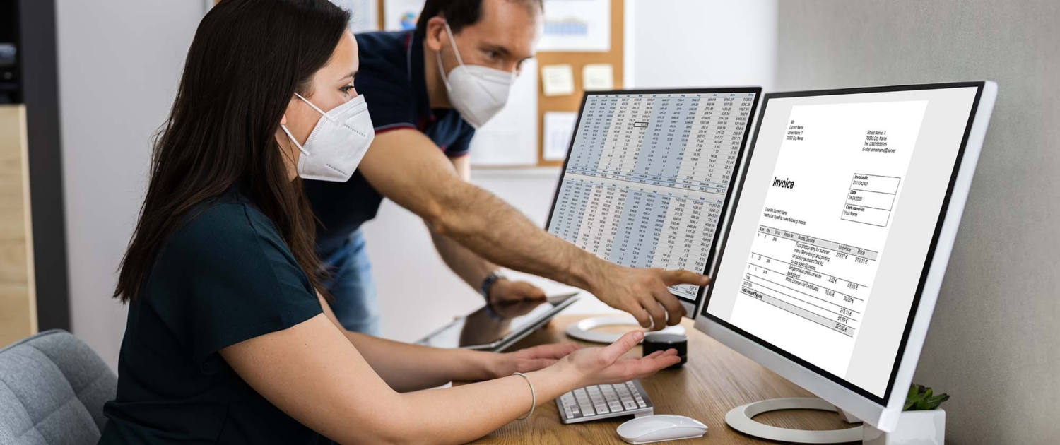 Man Showing Coworker Invoice for Medical Billing