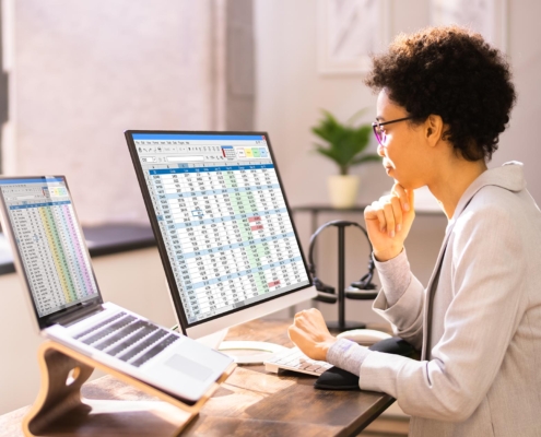 Image of a medical professional using billing software on a computer.