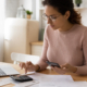 woman in eyeglasses managing medical bills