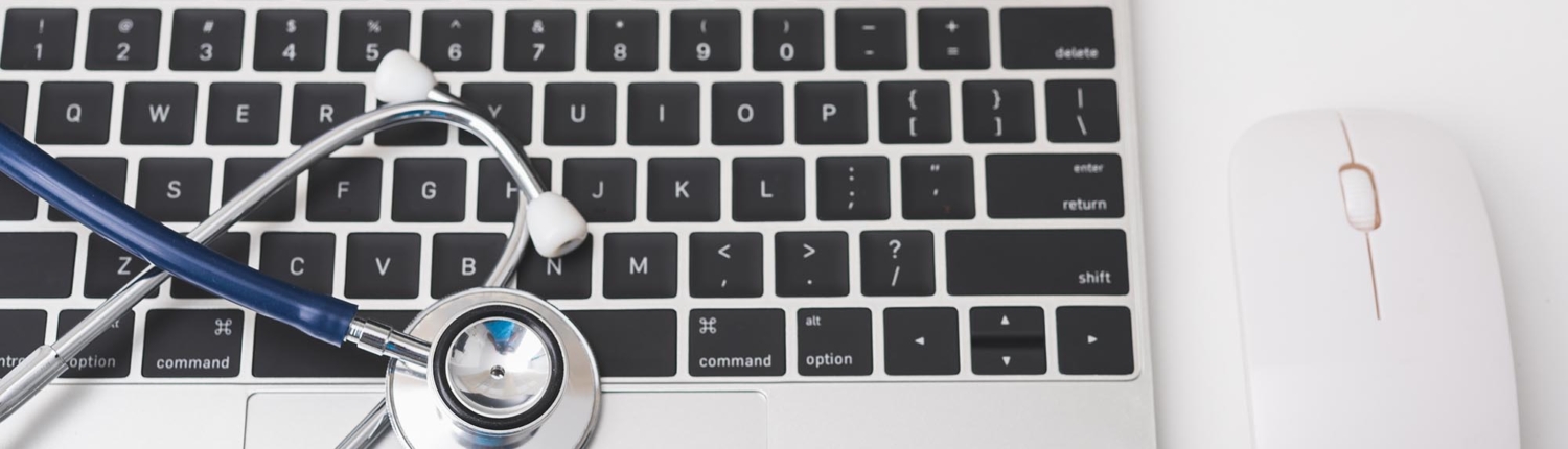 Stethoscope on top of laptop Stethoscope on top of laptop