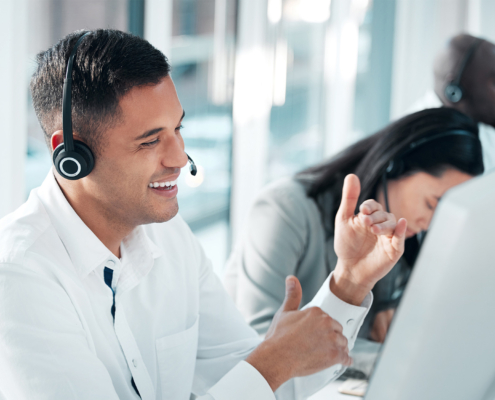 Side view of man with headset on smiling