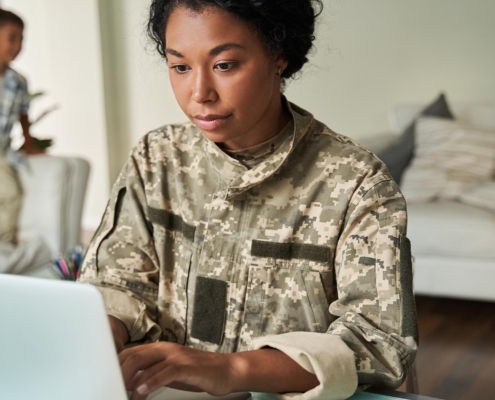 Military person on computer
